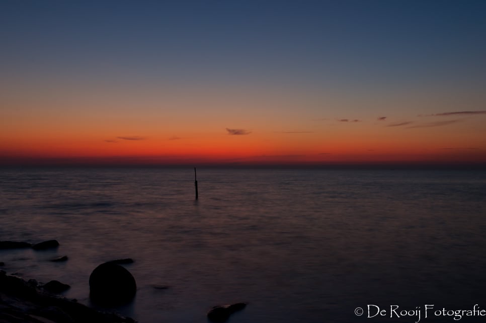 Zonsondergang bij het water fotograferen