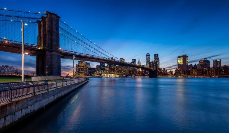 Skyline New York by Night from Brooklyn Bridge